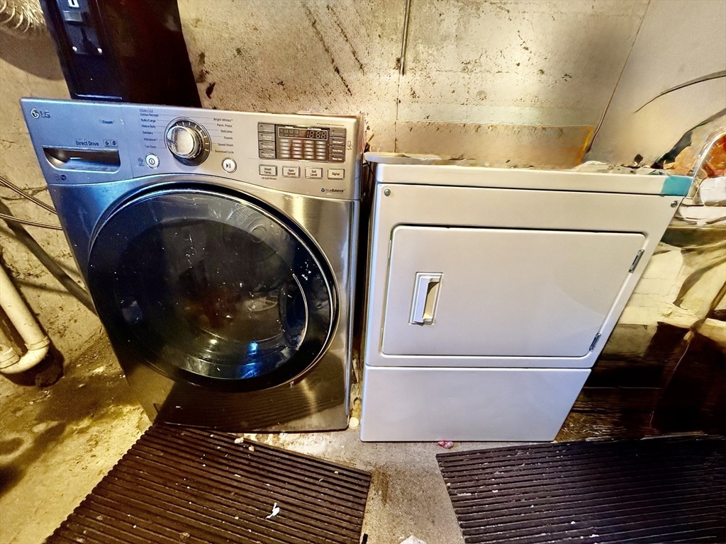 62 Algonquin Road, Unit 2 Newton, MA 02467 - Photo 37 of 38 a close up view of washer and dryer