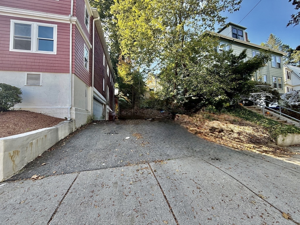 62 Algonquin Road, Unit 2 Newton, MA 02467 - Photo 38 of 38 a view of a house with a yard