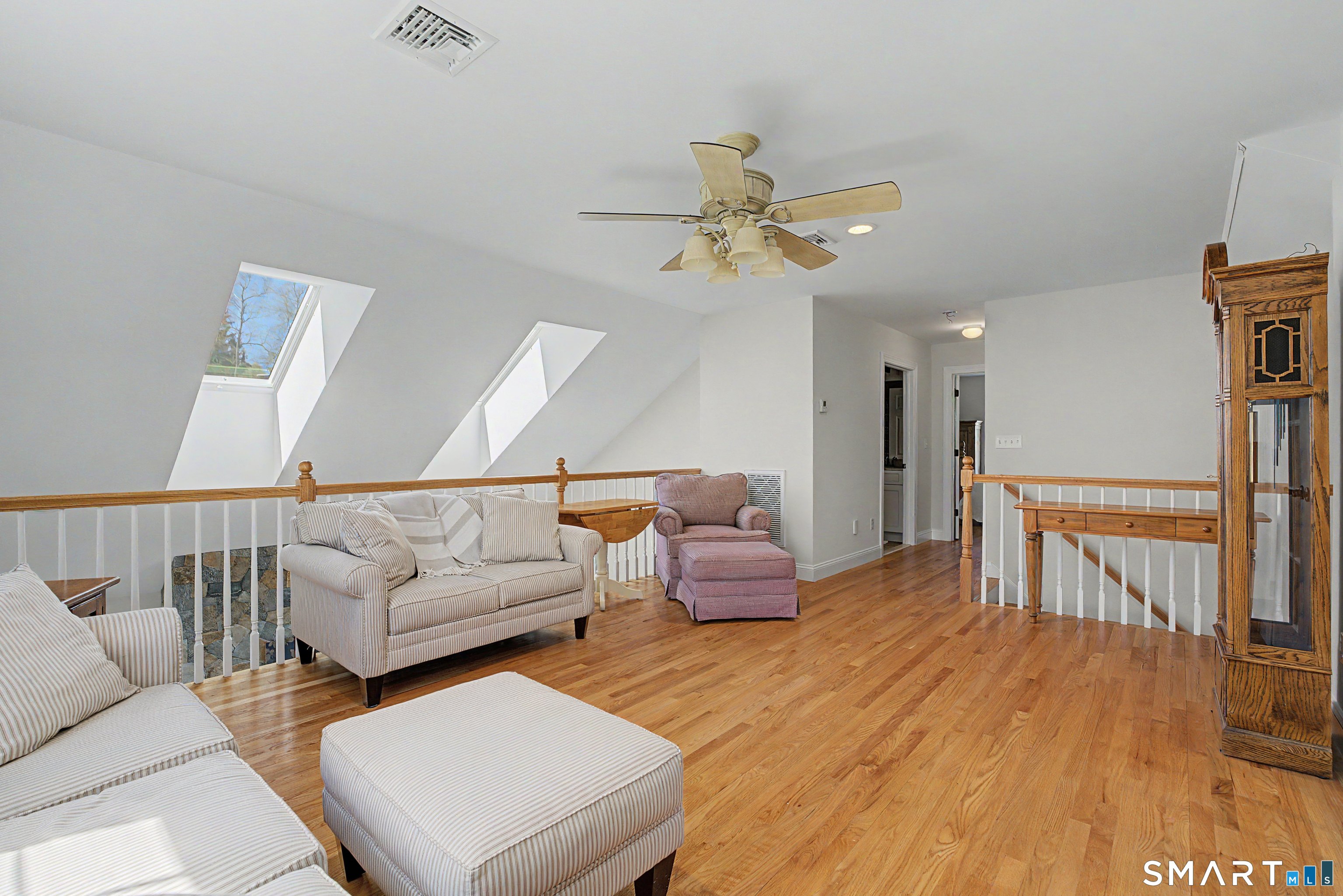 211 Meadowbrook Road, Unit 211 Oxford, CT 06478 - Photo 31 of 38 Another view of the loft with an open railing to the main living area, creating a sense of connection while providing a versatile upper-level living space