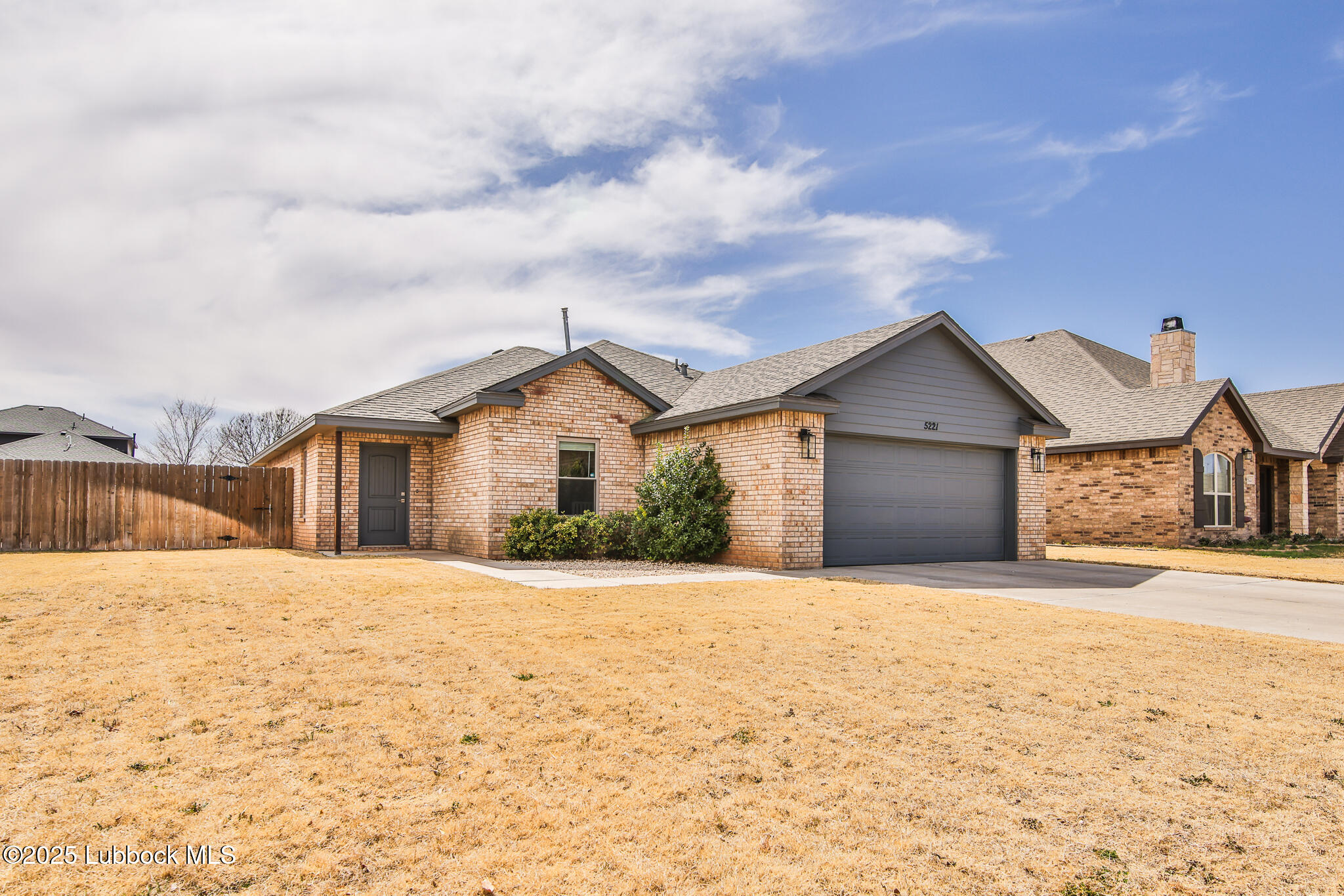 5221 Jarvis Street Lubbock, TX 79416 - Photo 1 of 22 a view of house with yard and mountain in the background