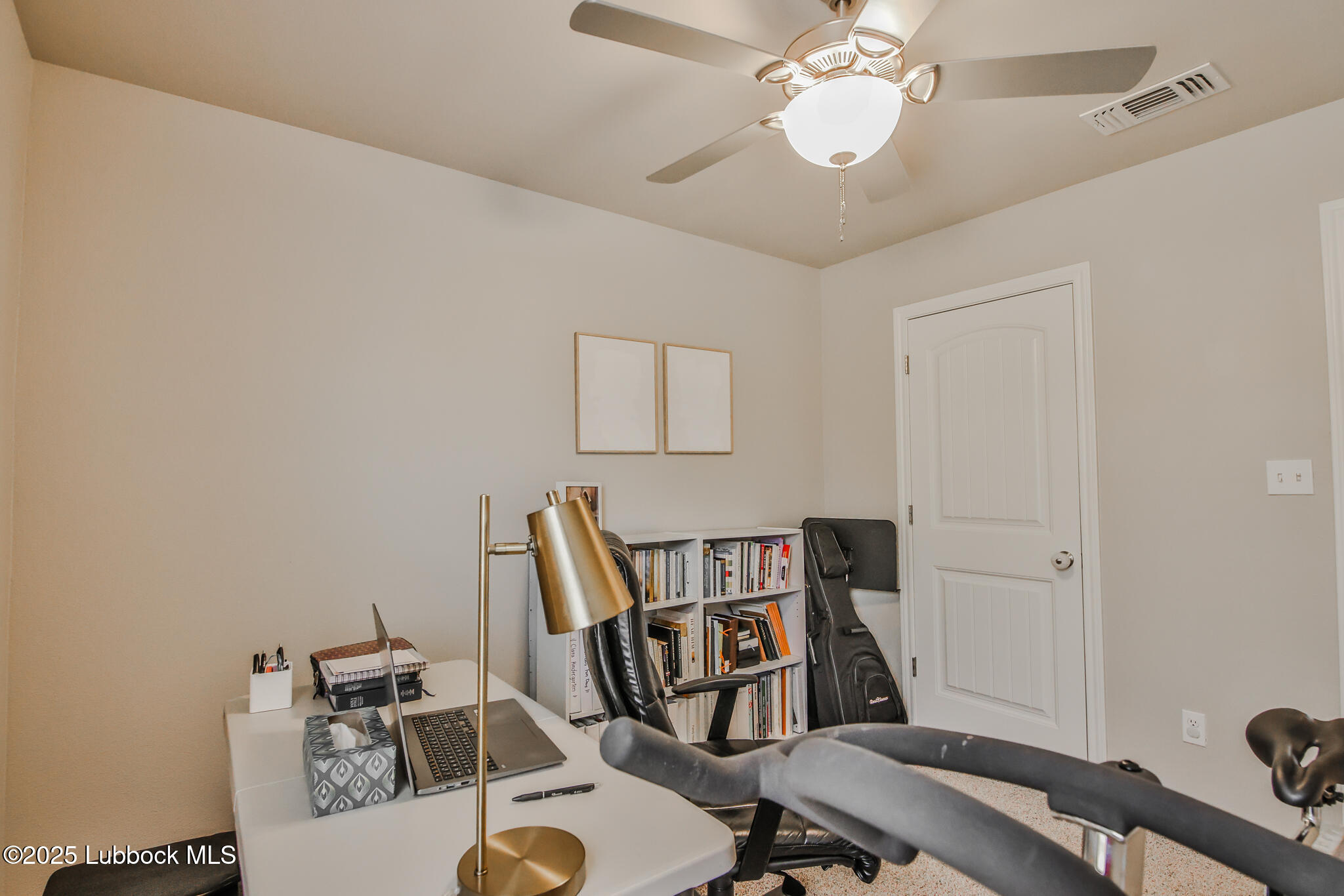 5221 Jarvis Street Lubbock, TX 79416 - Photo 11 of 22 a view of a workspace with furniture