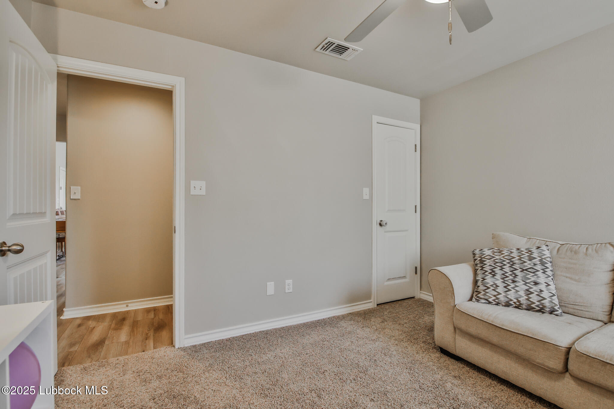 5221 Jarvis Street Lubbock, TX 79416 - Photo 15 of 22 a living room with furniture and a glass door shower