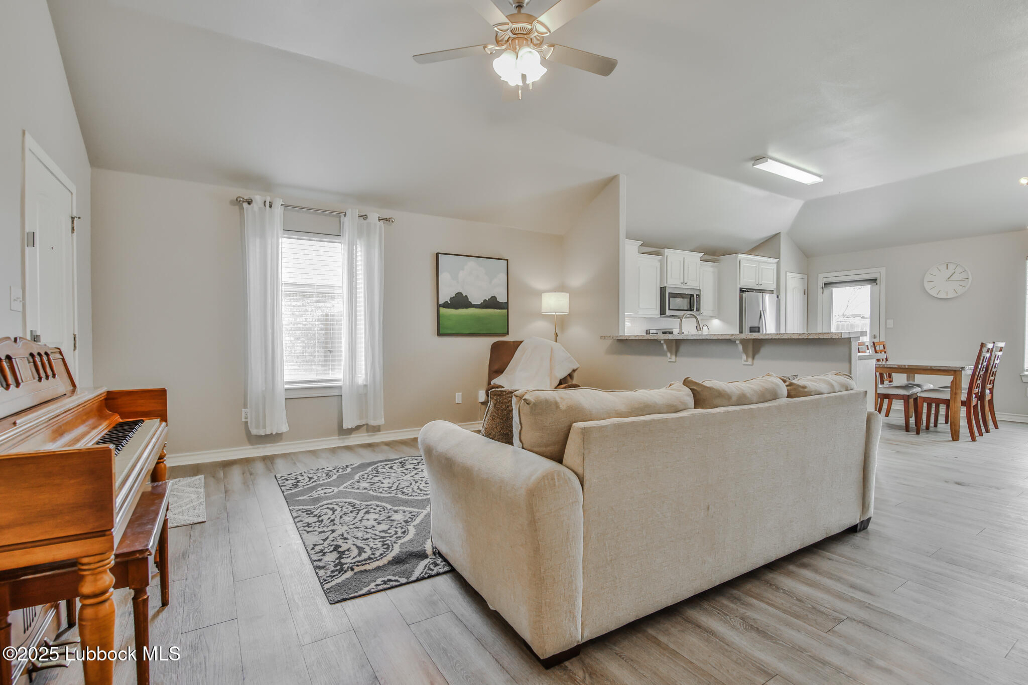 5221 Jarvis Street Lubbock, TX 79416 - Photo 16 of 22 a living room with furniture and a window