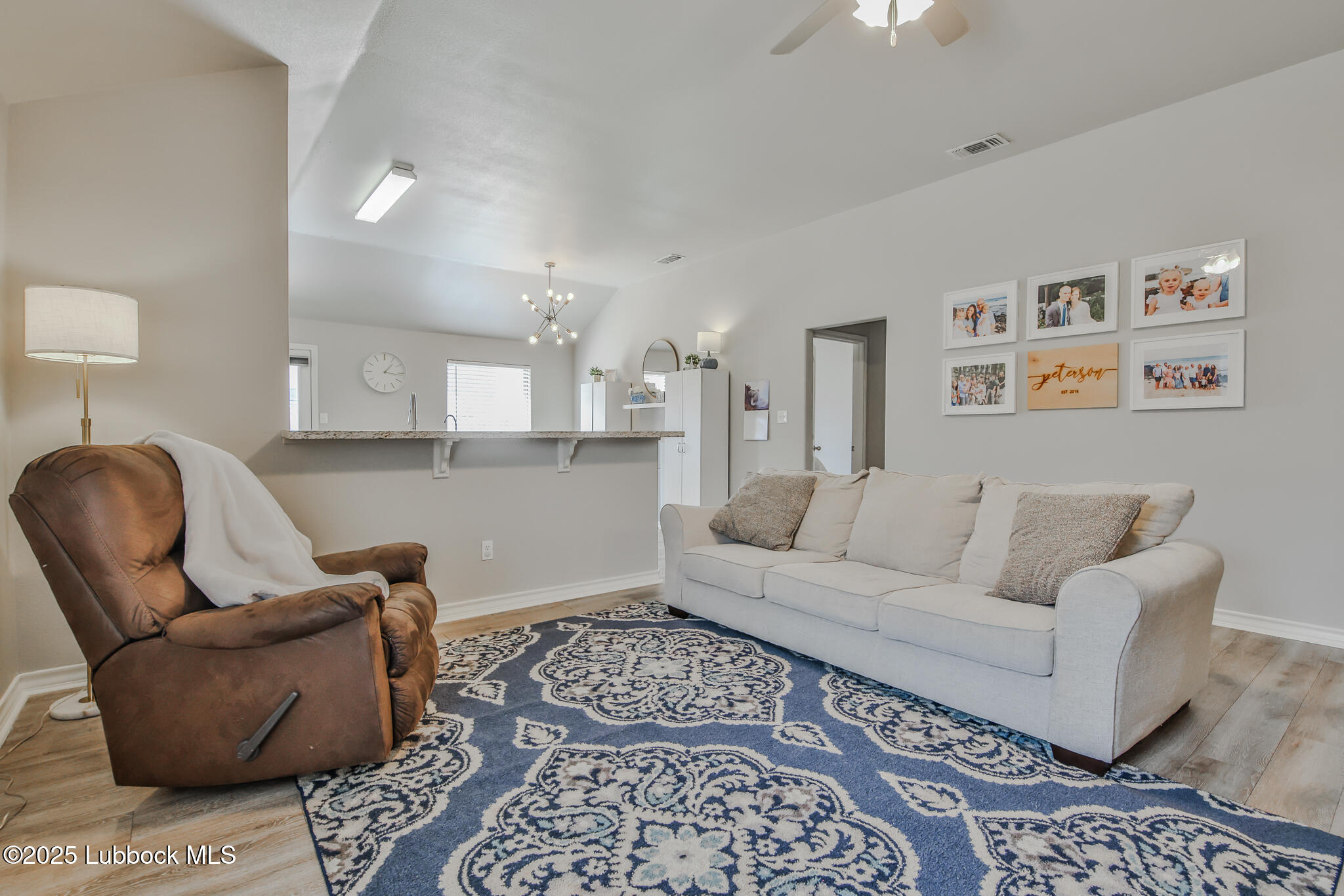 5221 Jarvis Street Lubbock, TX 79416 - Photo 17 of 22 a living room with furniture and a couch