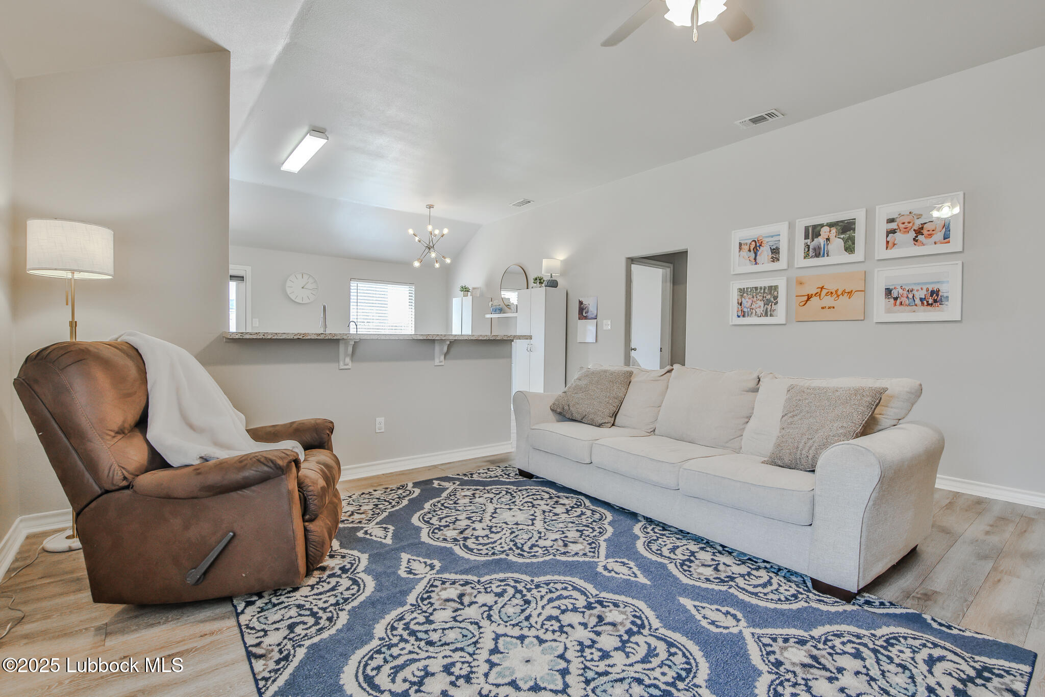 5221 Jarvis Street Lubbock, TX 79416 - Photo 18 of 22 a living room with furniture and a rug