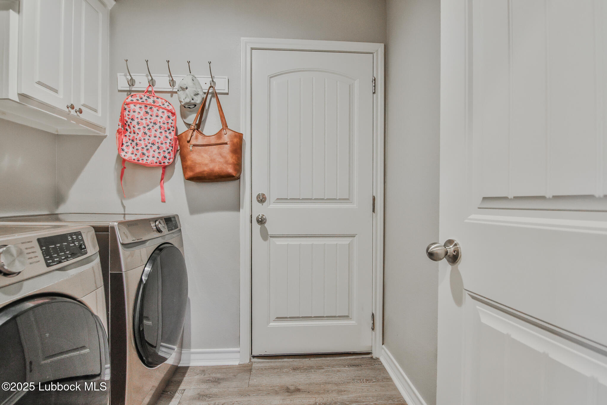 5221 Jarvis Street Lubbock, TX 79416 - Photo 8 of 22 a view of walk in closet with clothes and shoes