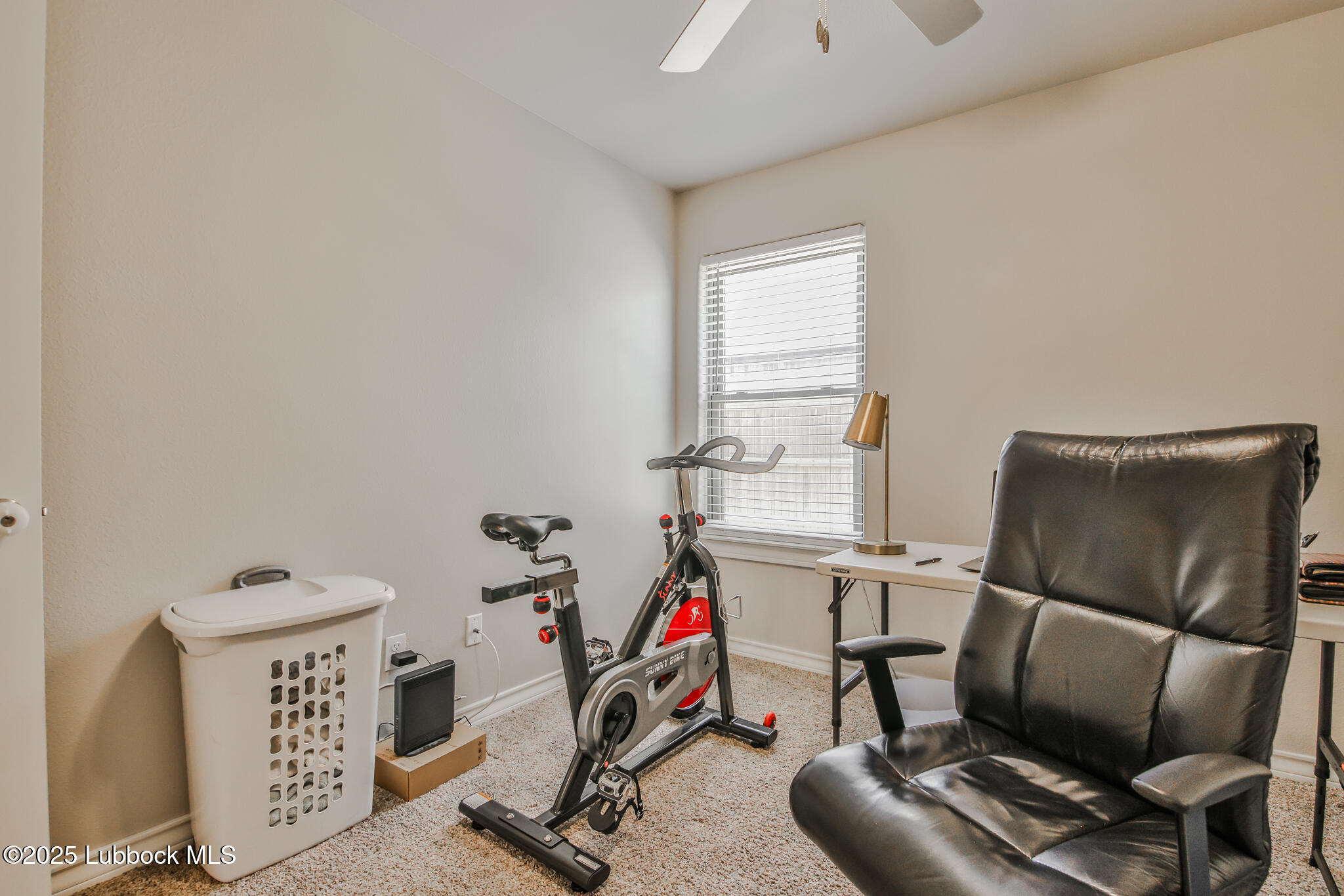 5221 Jarvis Street Lubbock, TX 79416 - Photo 10 of 22 a view of a room with gym equipment