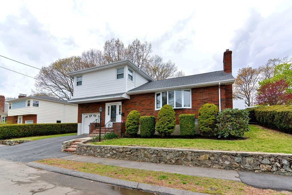 9 Doane Road Medford, MA 02155 - Photo 1 of 28 a front view of a house with a garden
