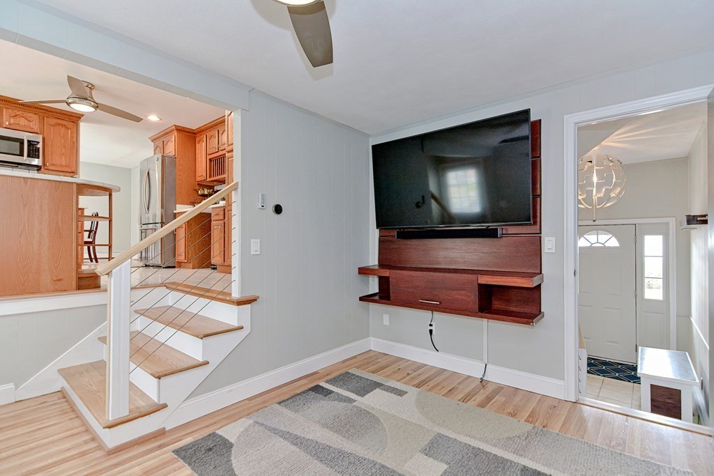 9 Doane Road Medford, MA 02155 - Photo 11 of 28 a living room with furniture and a flat screen tv