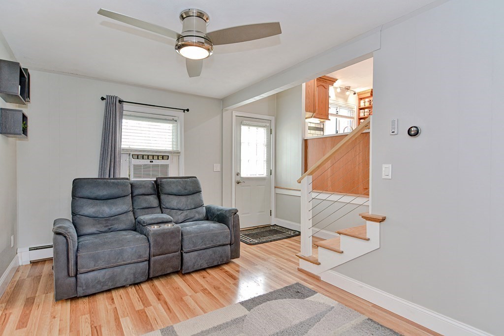 9 Doane Road Medford, MA 02155 - Photo 12 of 28 a living room with furniture and a wooden floor