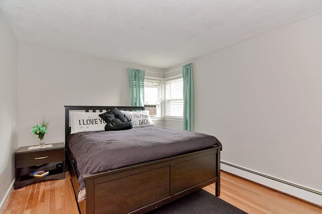 9 Doane Road Medford, MA 02155 - Photo 18 of 28 a bedroom with a bed and window
