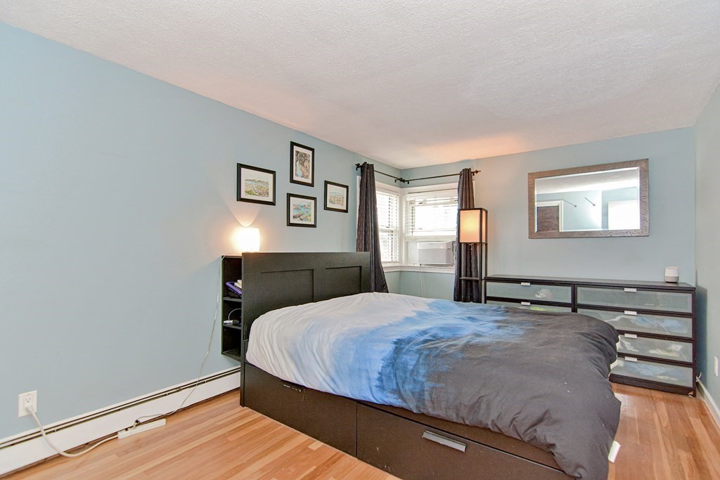 9 Doane Road Medford, MA 02155 - Photo 20 of 28 a bedroom with a bed and window