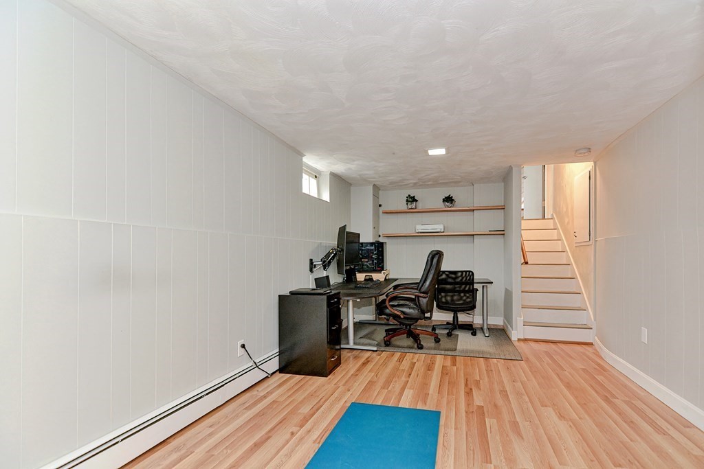 9 Doane Road Medford, MA 02155 - Photo 24 of 28 a view of a workspace with furniture and wooden floor