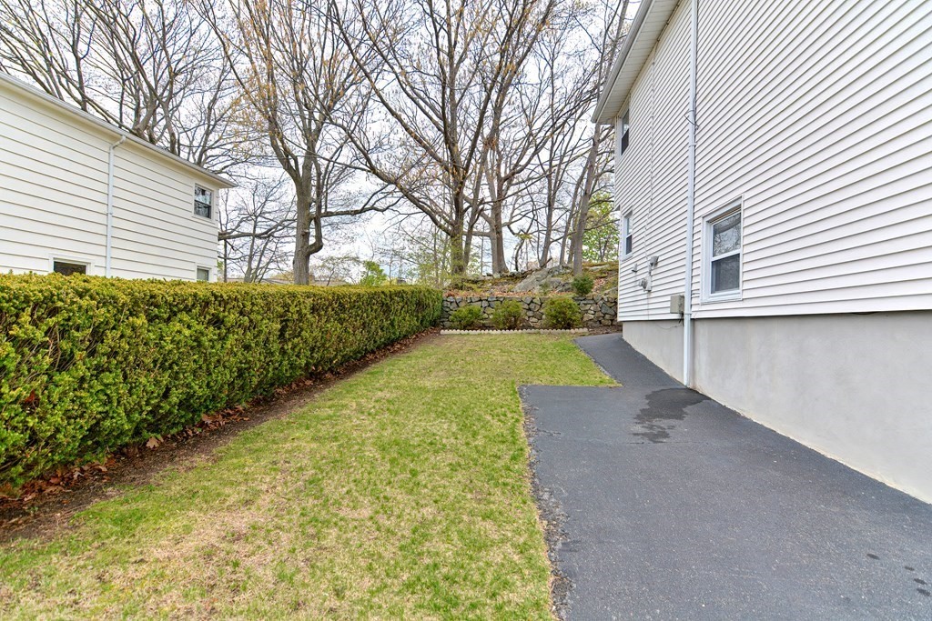 9 Doane Road Medford, MA 02155 - Photo 25 of 28 a view of a yard with yellow house