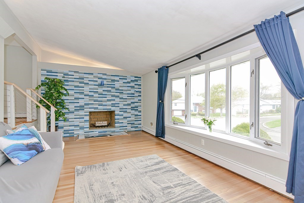 9 Doane Road Medford, MA 02155 - Photo 6 of 28 a view of empty room with fireplace and windows