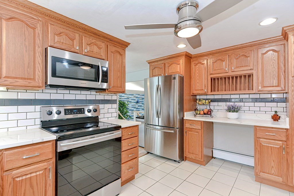 9 Doane Road Medford, MA 02155 - Photo 9 of 28 a kitchen with granite countertop a refrigerator oven a sink dishwasher and a refrigerator
