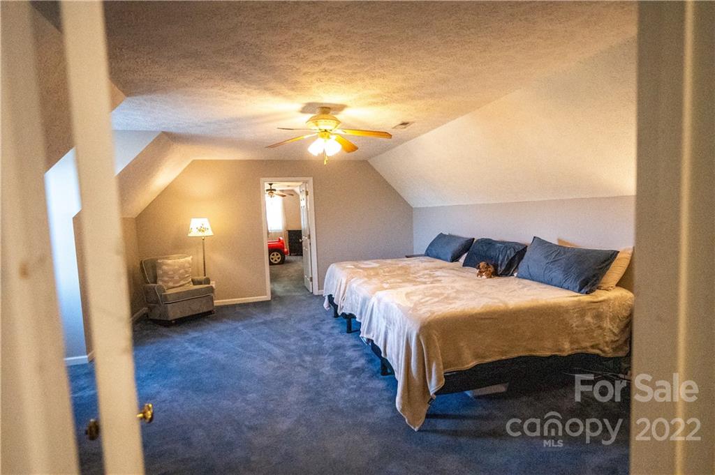 565 Salem Church Road Bostic, NC 28018 - Photo 35 of 44 a bedroom with a bed and a view of en suite bathroom