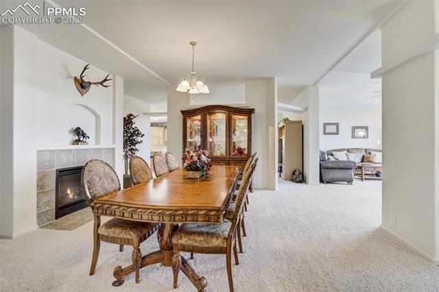 688 Tiara Road Lake George, CO 80827 - Photo 14 of 46 Formal dining area with fireplace