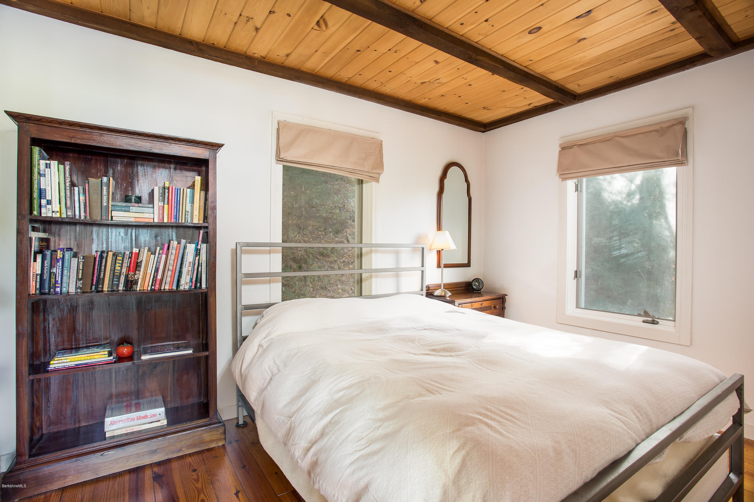 116 Hupi Road Monterey, MA 01245 - Photo 12 of 17 a large bed sitting in a bedroom next to a window