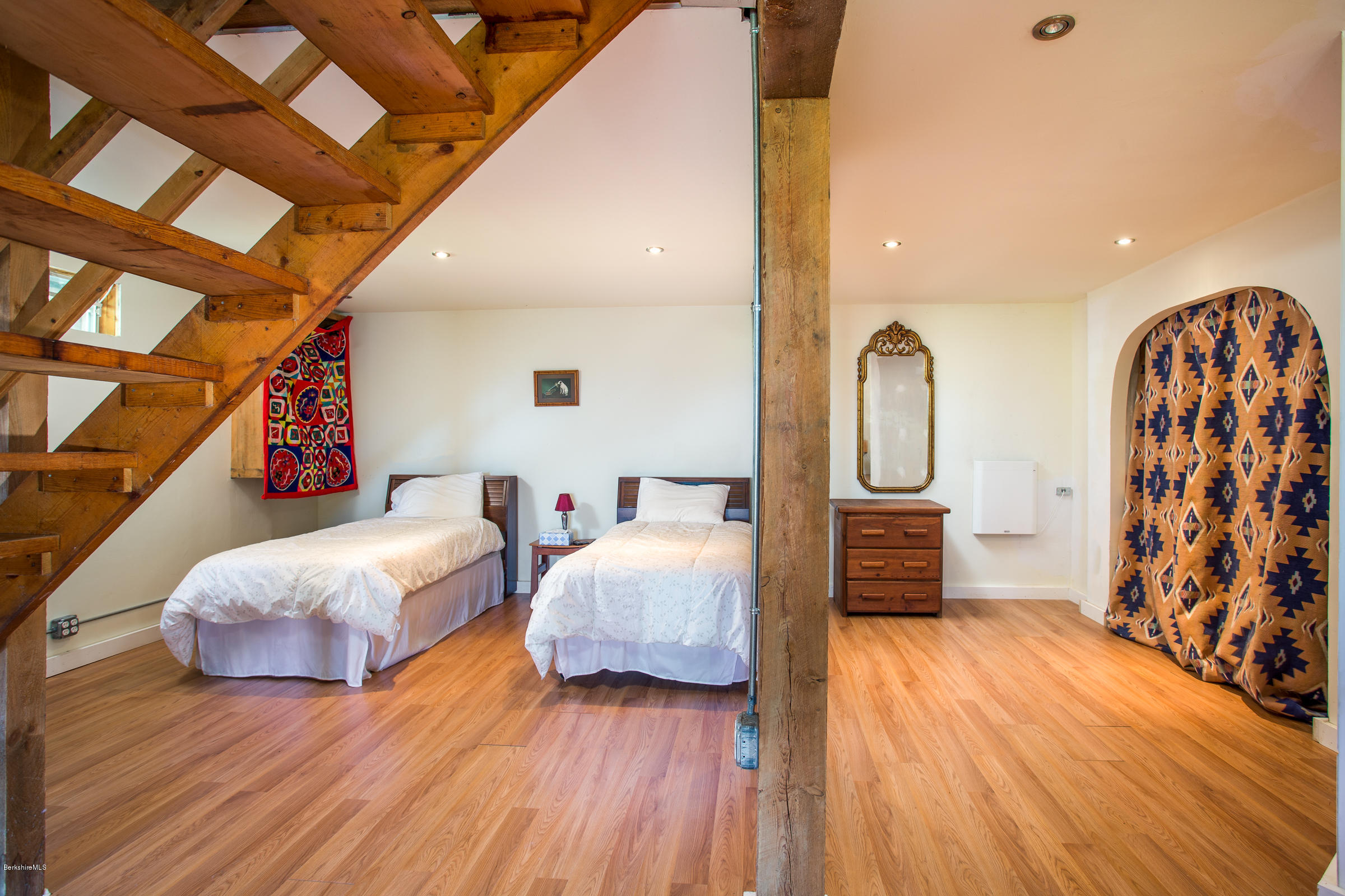 116 Hupi Road Monterey, MA 01245 - Photo 16 of 17 a spacious bedroom with two beds and wooden floor
