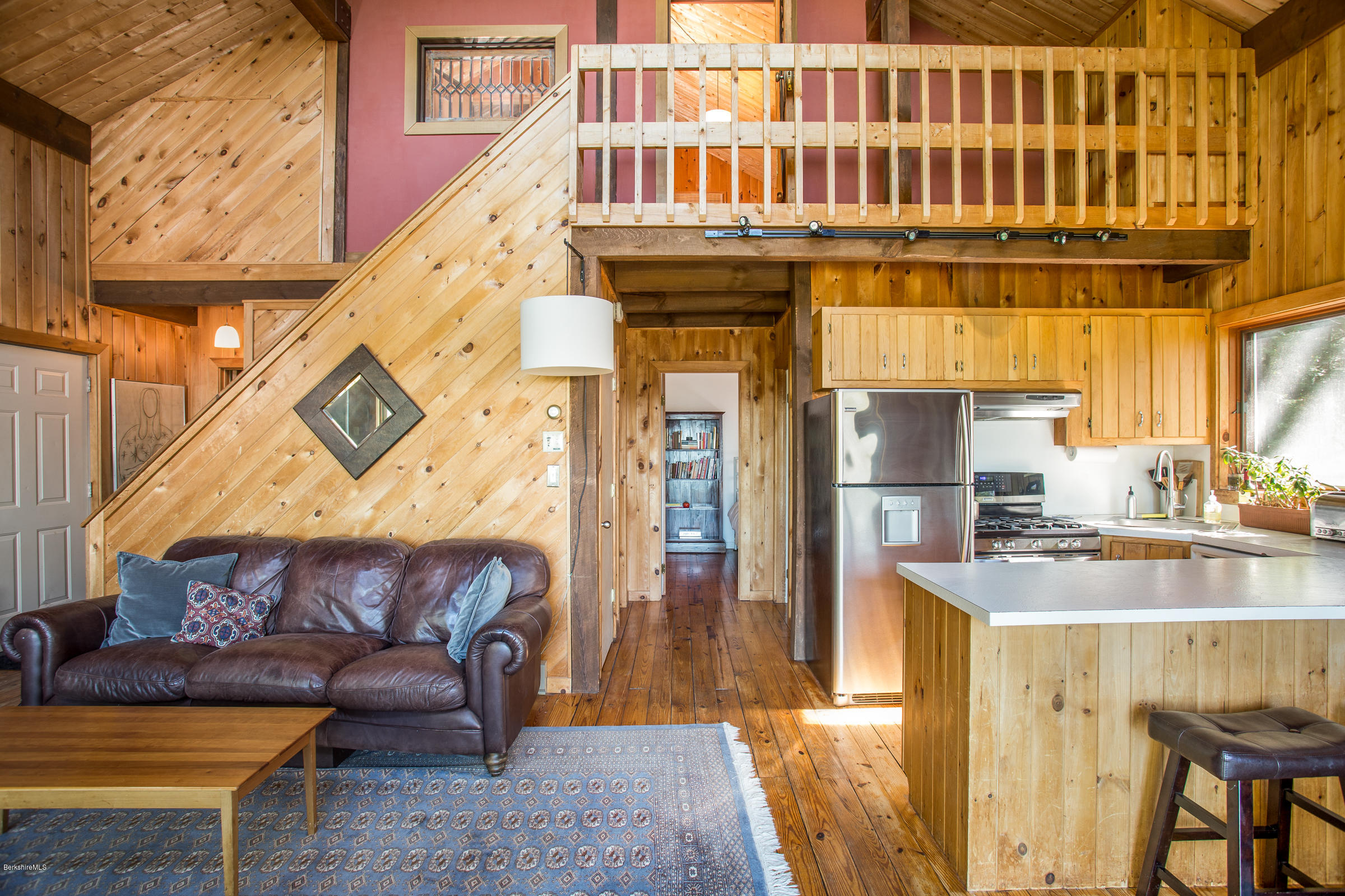 116 Hupi Road Monterey, MA 01245 - Photo 5 of 17 a view of a balcony with furniture and wooden floor