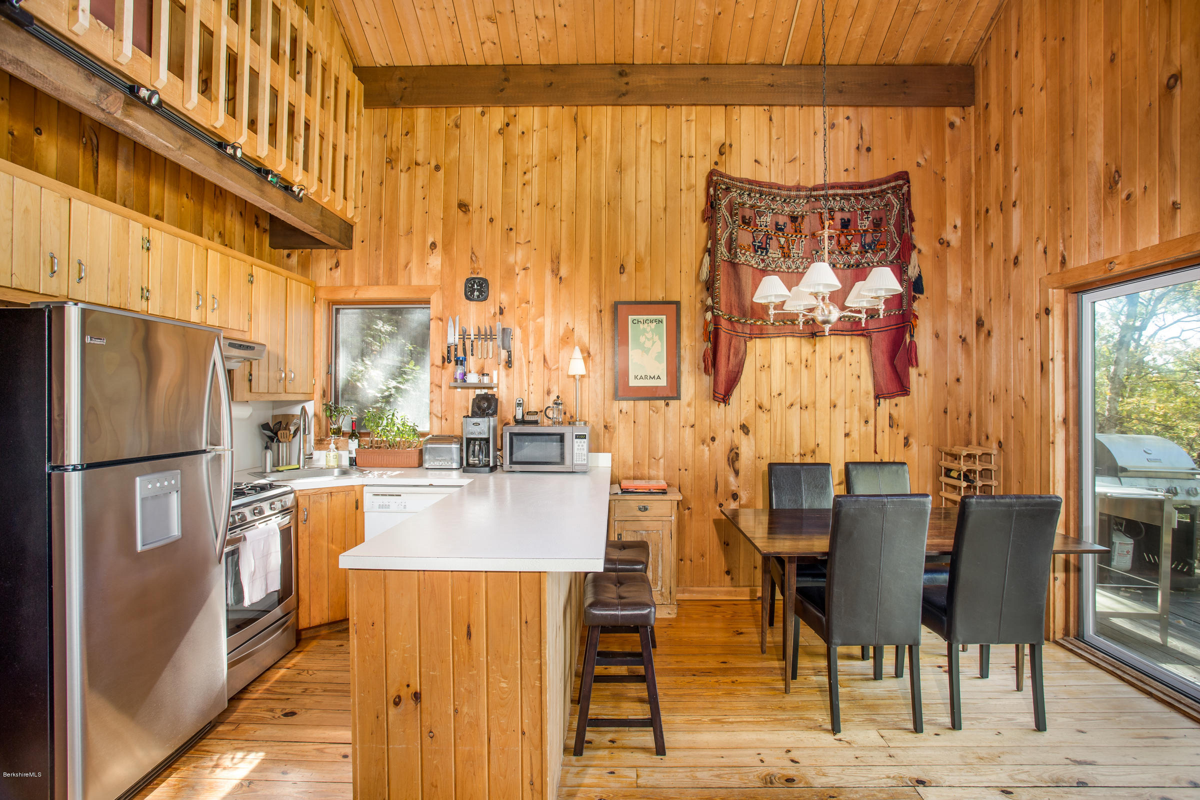116 Hupi Road Monterey, MA 01245 - Photo 6 of 17 a kitchen with stainless steel appliances kitchen island granite countertop a refrigerator and a stove top oven