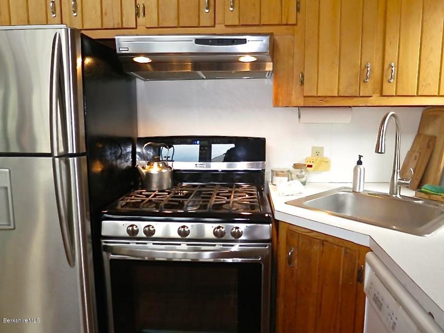 116 Hupi Road Monterey, MA 01245 - Photo 7 of 17 a kitchen with a stove and a refrigerator