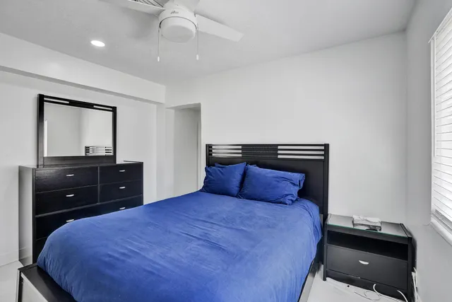 a bedroom with a bed and a closet