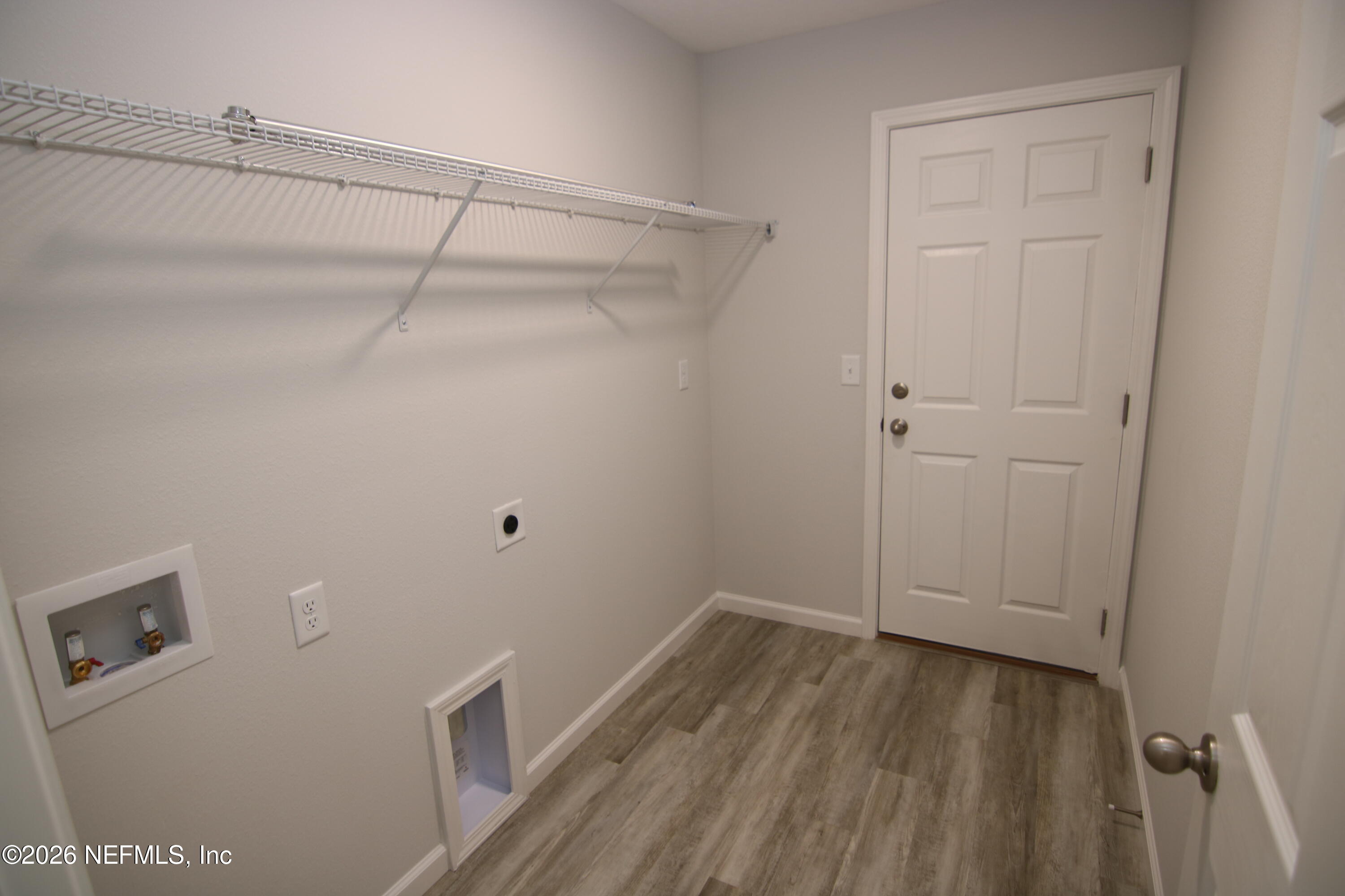 853 Jackson Road Jacksonville, FL 32225 - Photo 14 of 18 a view of a room with wooden floor