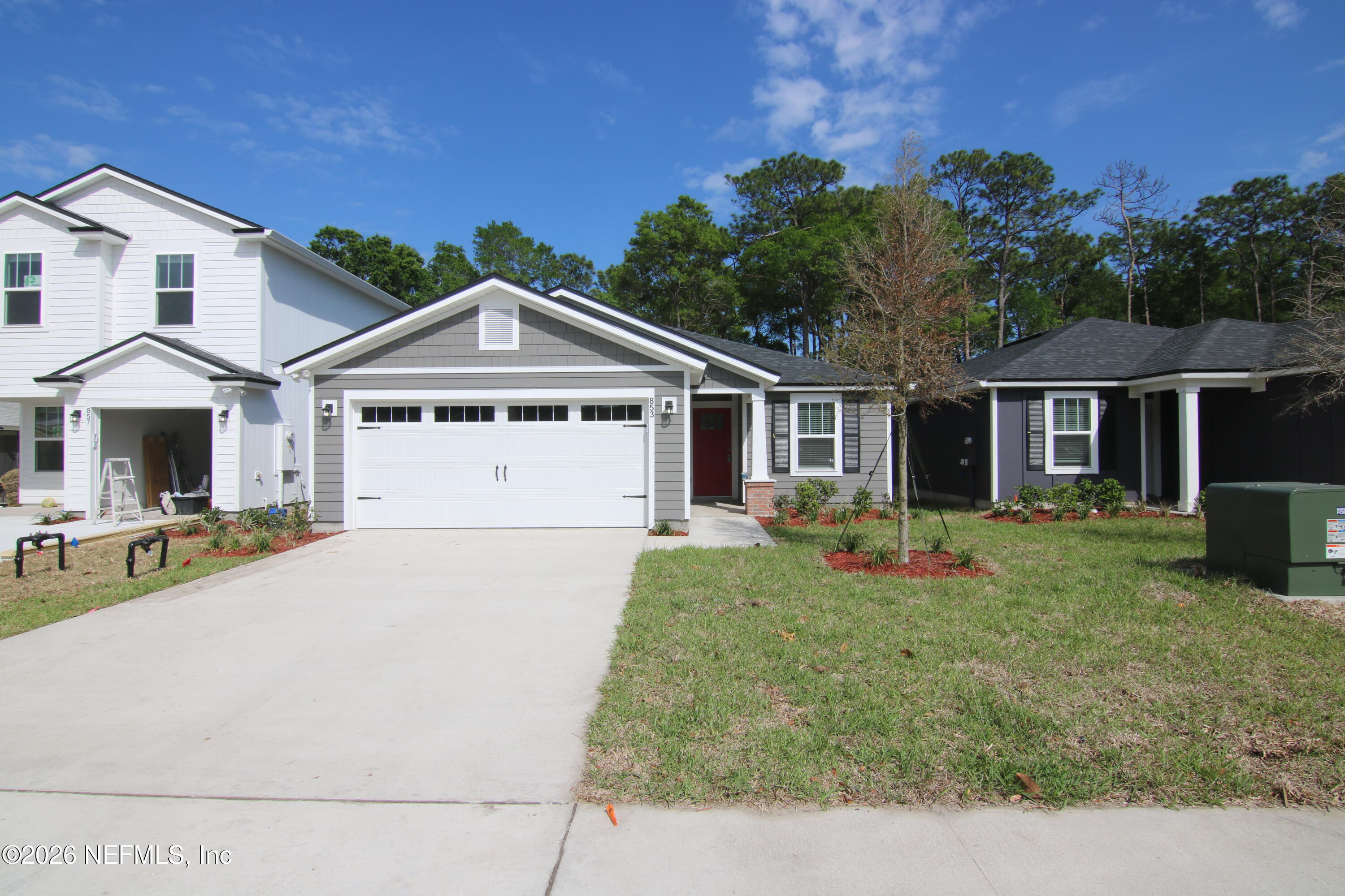 853 Jackson Road Jacksonville, FL 32225 - Photo 2 of 18 a front view of a house with a yard