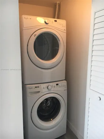 a bedroom with a bed and chair