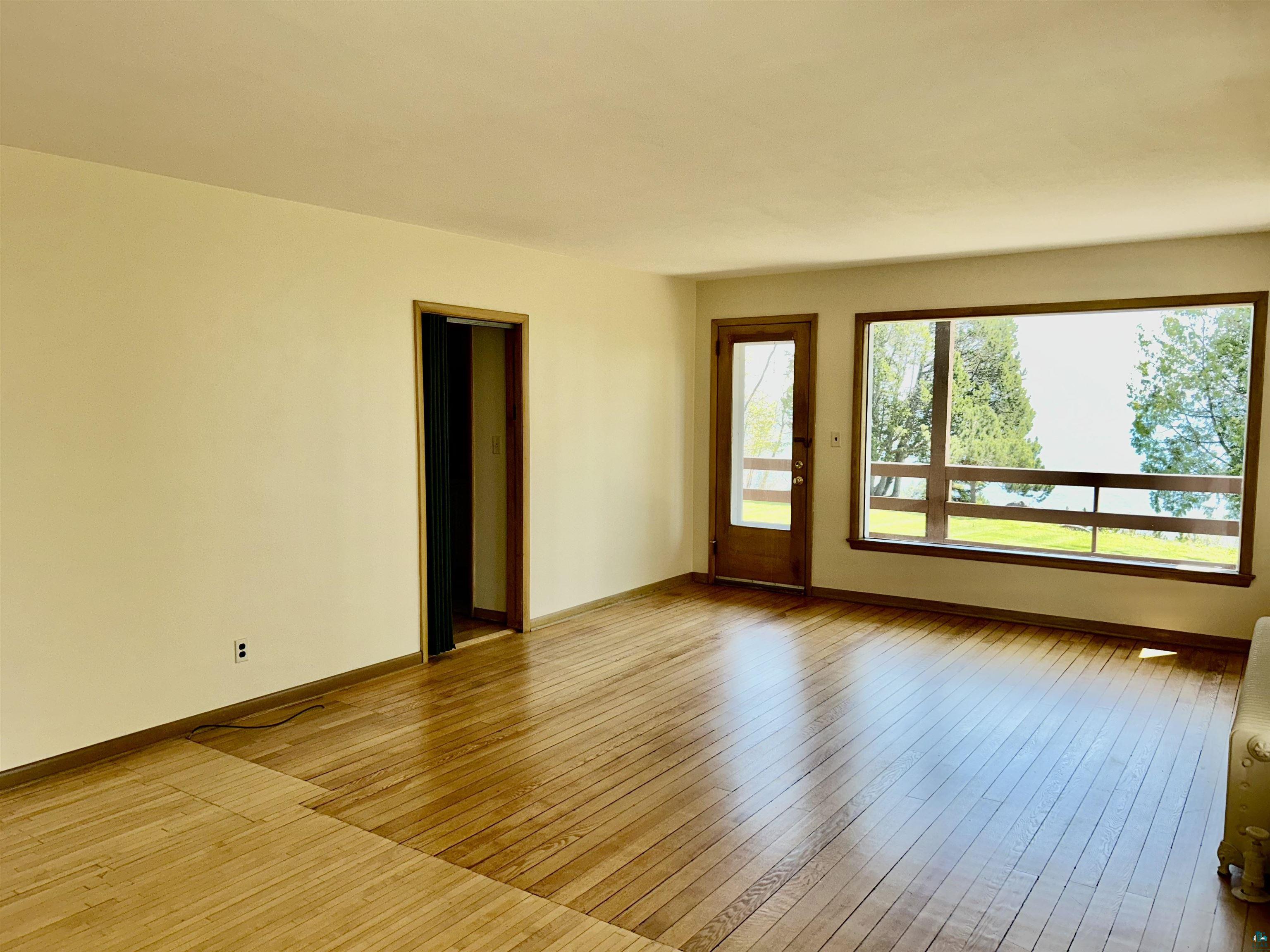 5090 London Road, Unit 1 Duluth, MN 55804 - Photo 15 of 54 Expansive living space featuring wood-finish flooring and a large picture window