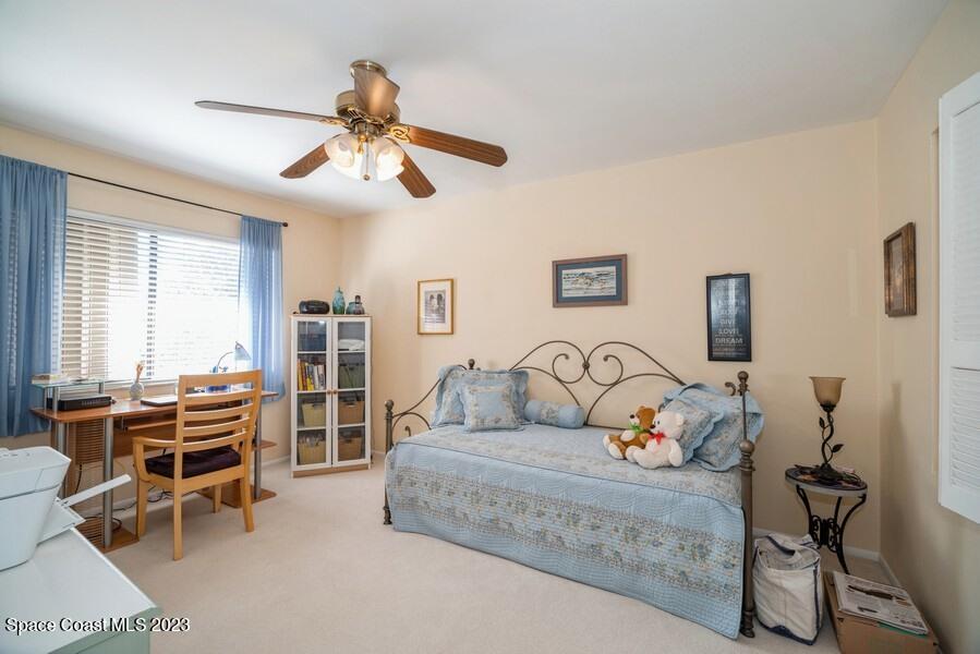 1638 Dawes Road Northeast Palm Bay, FL 32905 - Photo 14 of 26 a living room with furniture and wooden floor