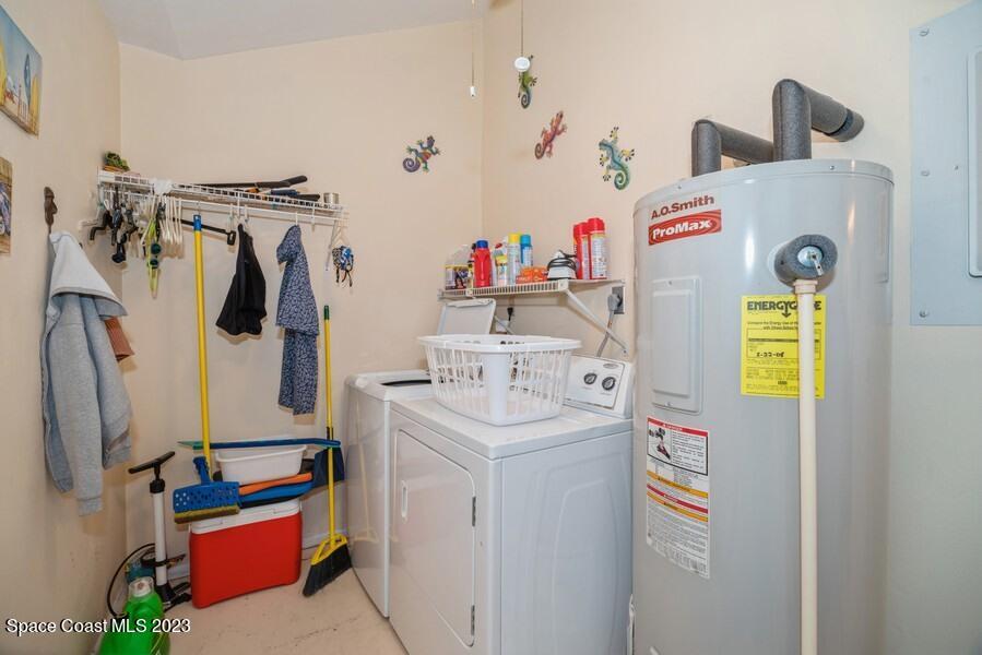 1638 Dawes Road Northeast Palm Bay, FL 32905 - Photo 16 of 26 a utility room with fridge and washer