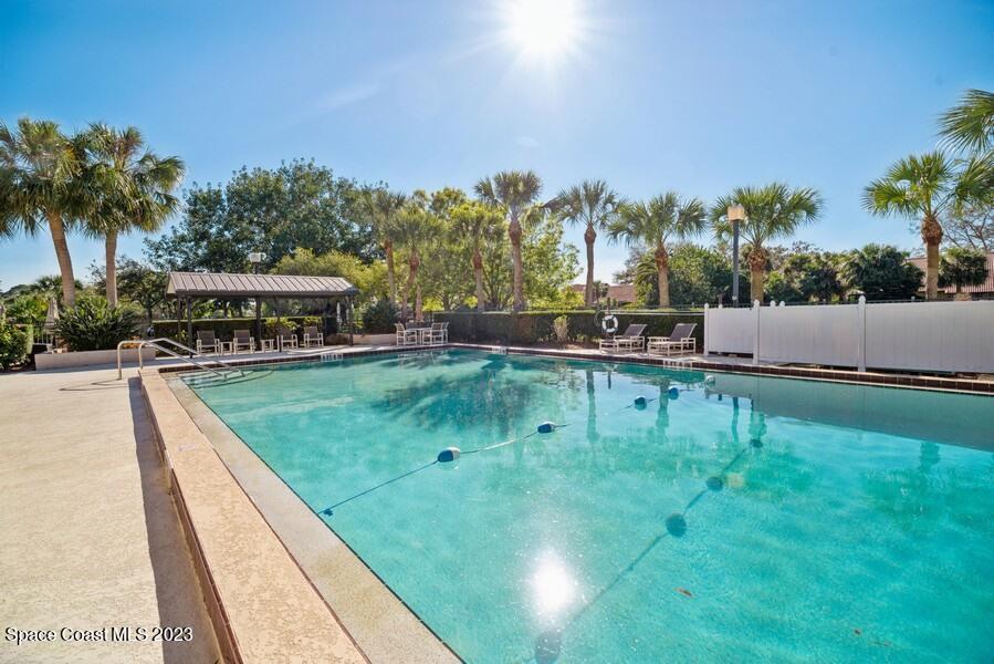 1638 Dawes Road Northeast Palm Bay, FL 32905 - Photo 17 of 26 a swimming pool with outdoor seating and yard