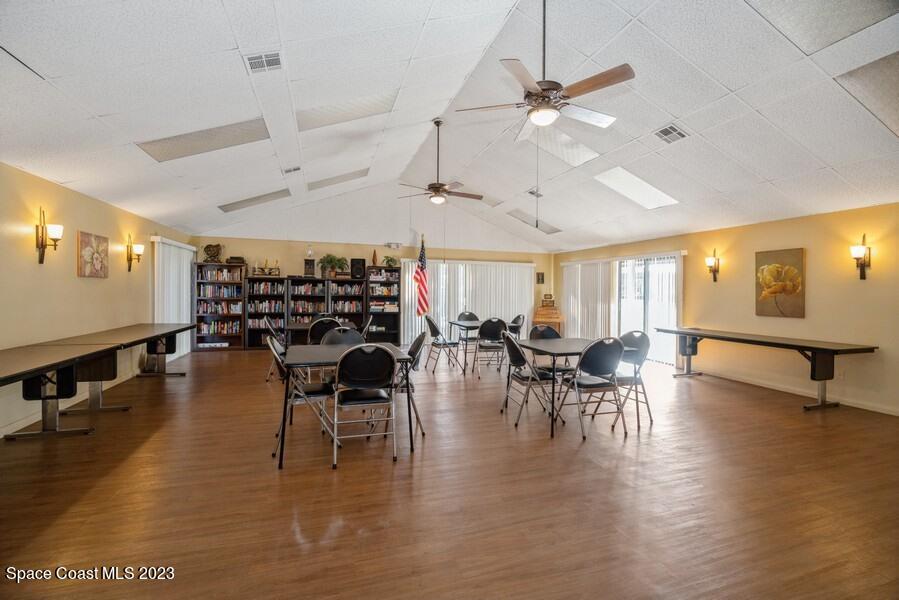 1638 Dawes Road Northeast Palm Bay, FL 32905 - Photo 21 of 26 a dining room with furniture and wooden floor