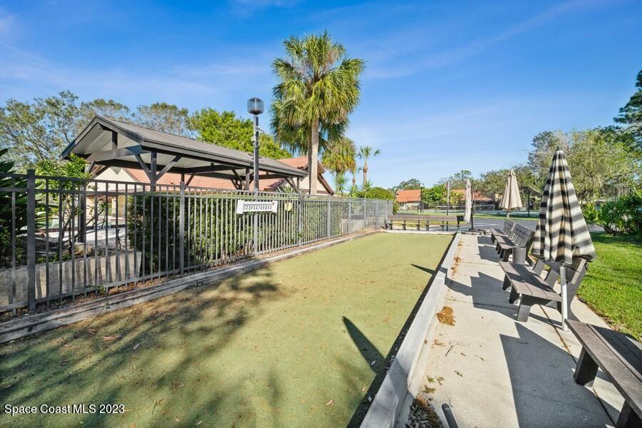 1638 Dawes Road Northeast Palm Bay, FL 32905 - Photo 23 of 26 a view of a swimming pool with a lounge chairs