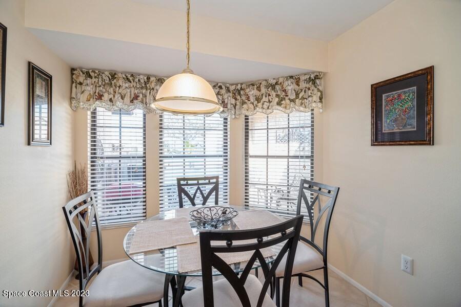 1638 Dawes Road Northeast Palm Bay, FL 32905 - Photo 6 of 26 a view of a dining room with furniture window and outside view