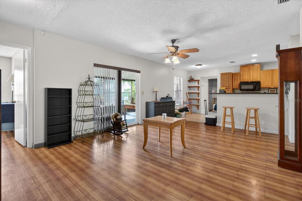 750 Caliente Drive Brandon, FL 33511 - Photo 13 of 71 a living room with furniture and a wooden floor