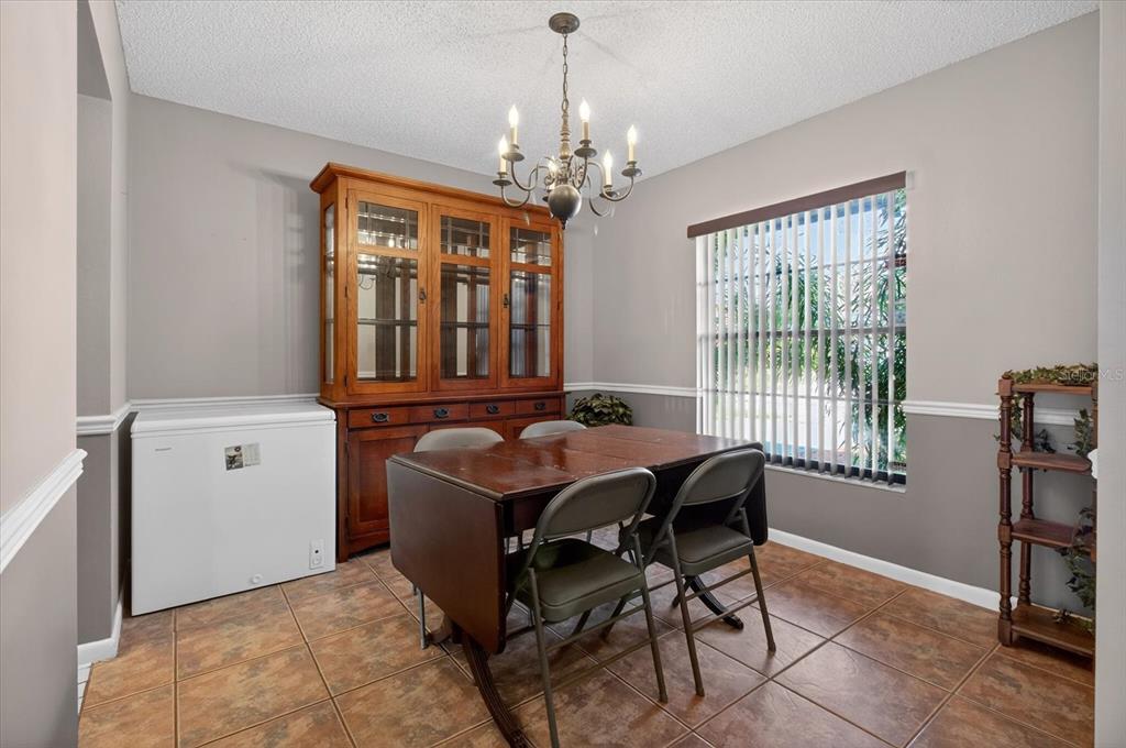 750 Caliente Drive Brandon, FL 33511 - Photo 24 of 71 a dining room with furniture and window