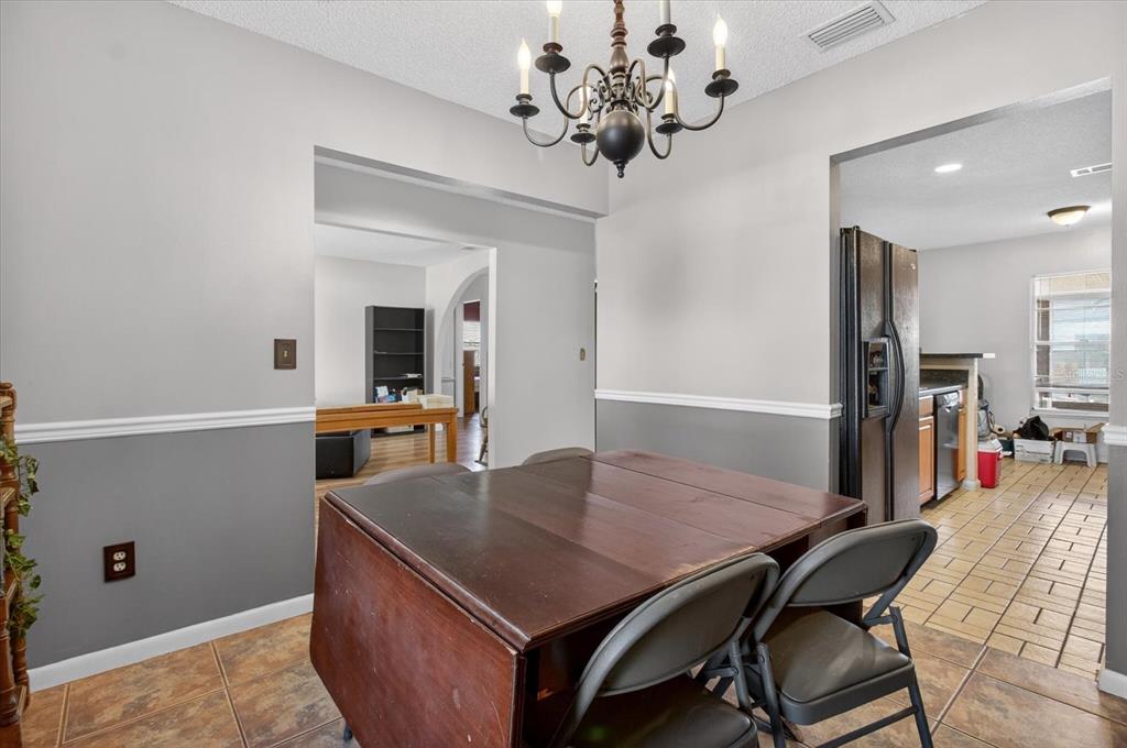 750 Caliente Drive Brandon, FL 33511 - Photo 26 of 71 a view of a dining room with furniture and wooden floor