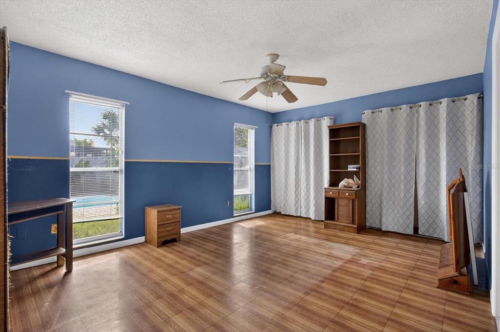 750 Caliente Drive Brandon, FL 33511 - Photo 27 of 71 a view of empty room with wooden floor and fan