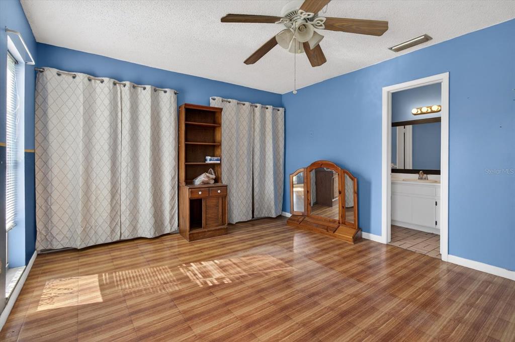 750 Caliente Drive Brandon, FL 33511 - Photo 28 of 71 a view of a room with a fireplace and wooden floor