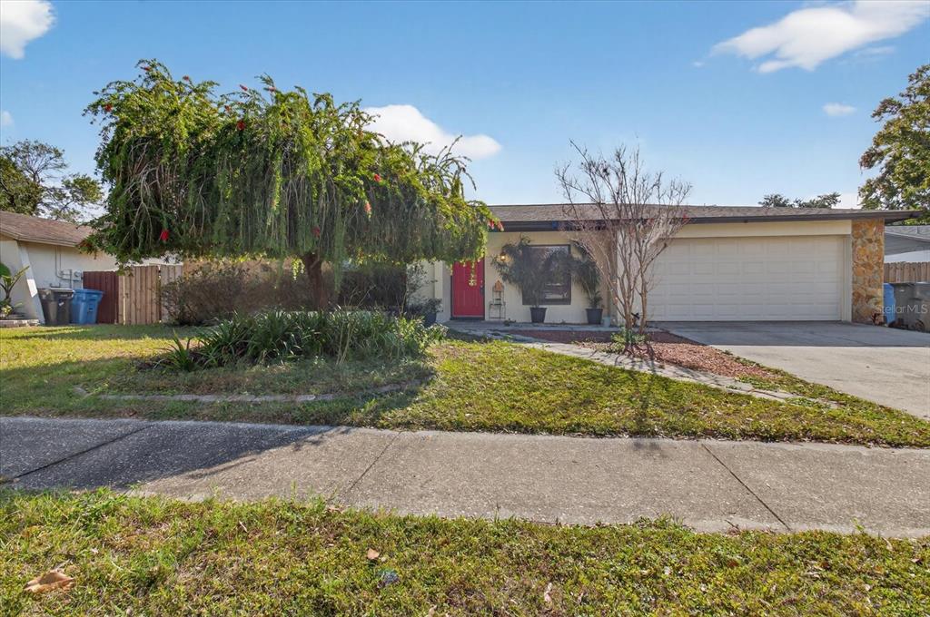 750 Caliente Drive Brandon, FL 33511 - Photo 3 of 71 a front view of a house with garden