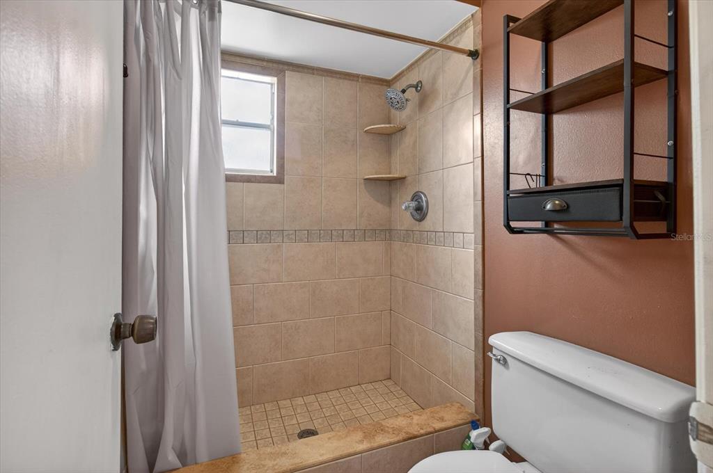 750 Caliente Drive Brandon, FL 33511 - Photo 32 of 71 a bathroom with a shower and toilet