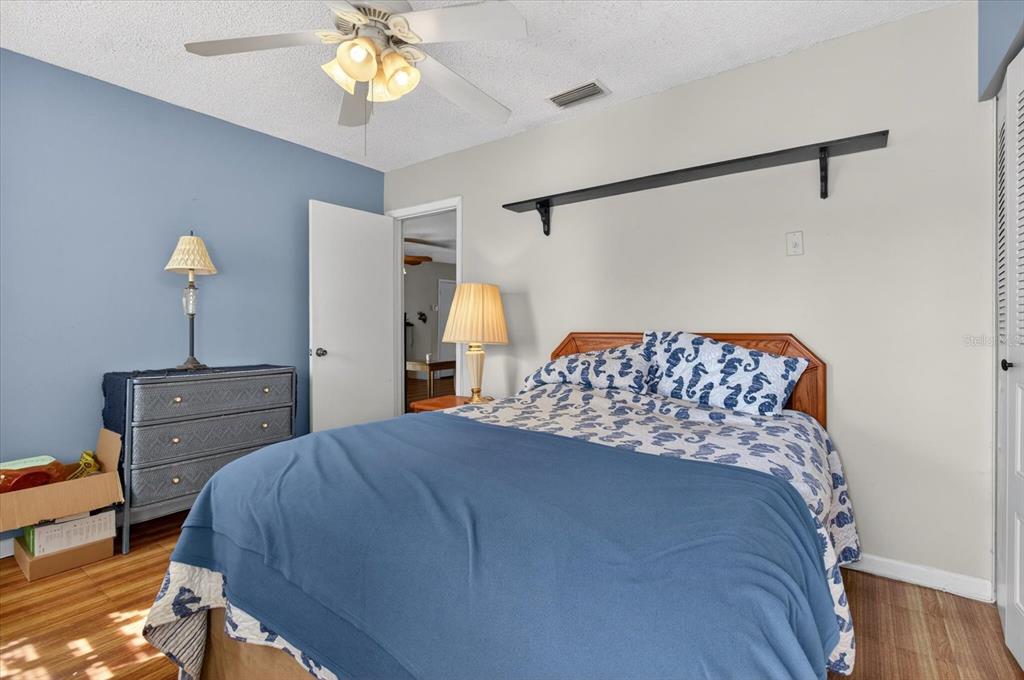 750 Caliente Drive Brandon, FL 33511 - Photo 36 of 71 a bedroom with a bed and a chandelier