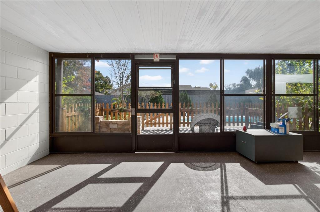 750 Caliente Drive Brandon, FL 33511 - Photo 45 of 71 a living room with a large window and a table