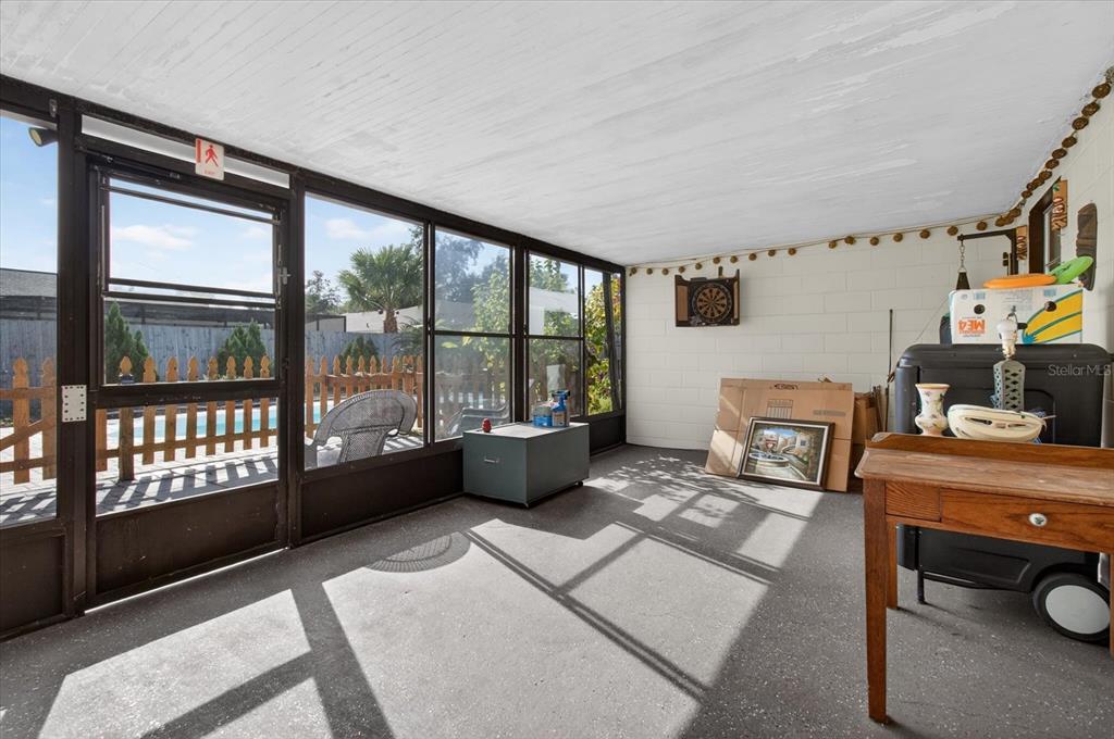750 Caliente Drive Brandon, FL 33511 - Photo 46 of 71 a living room with furniture and a floor to ceiling window