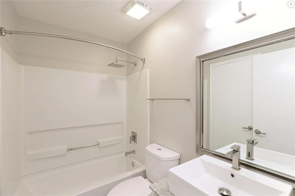 916 Beaver Grade Road Coraopolis, PA 15108 - Photo 11 of 17 a bathroom with a sink a toilet and shower