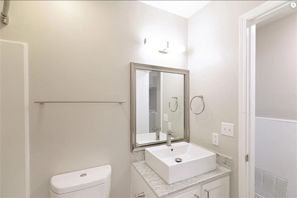 916 Beaver Grade Road Coraopolis, PA 15108 - Photo 10 of 17 a bathroom with a sink a toilet and mirror